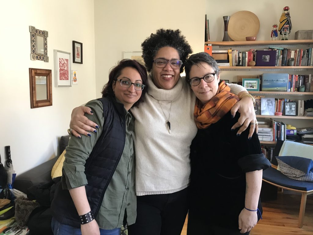 Anjali Taneja, Cara Page and Susan Raffo embracing after a working retreat together in NYC